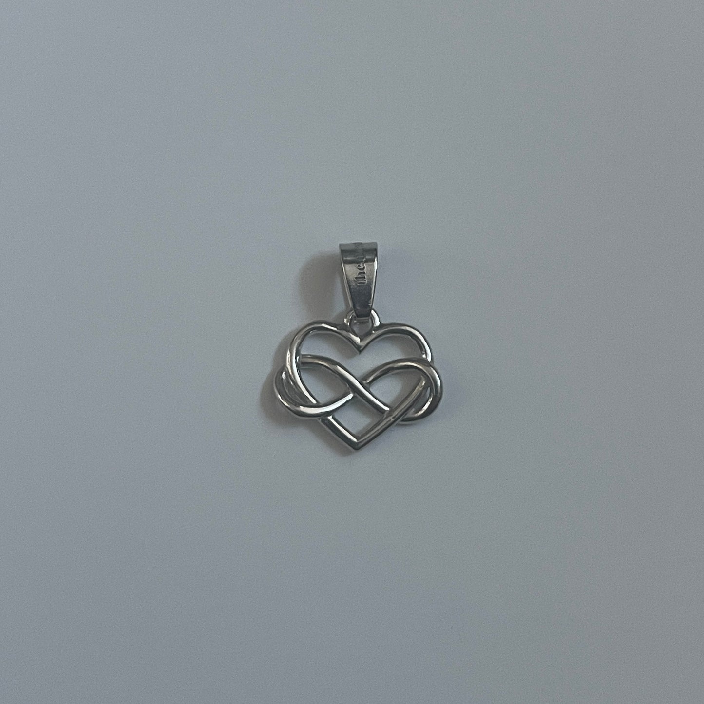 the INFINITE LOVE charm