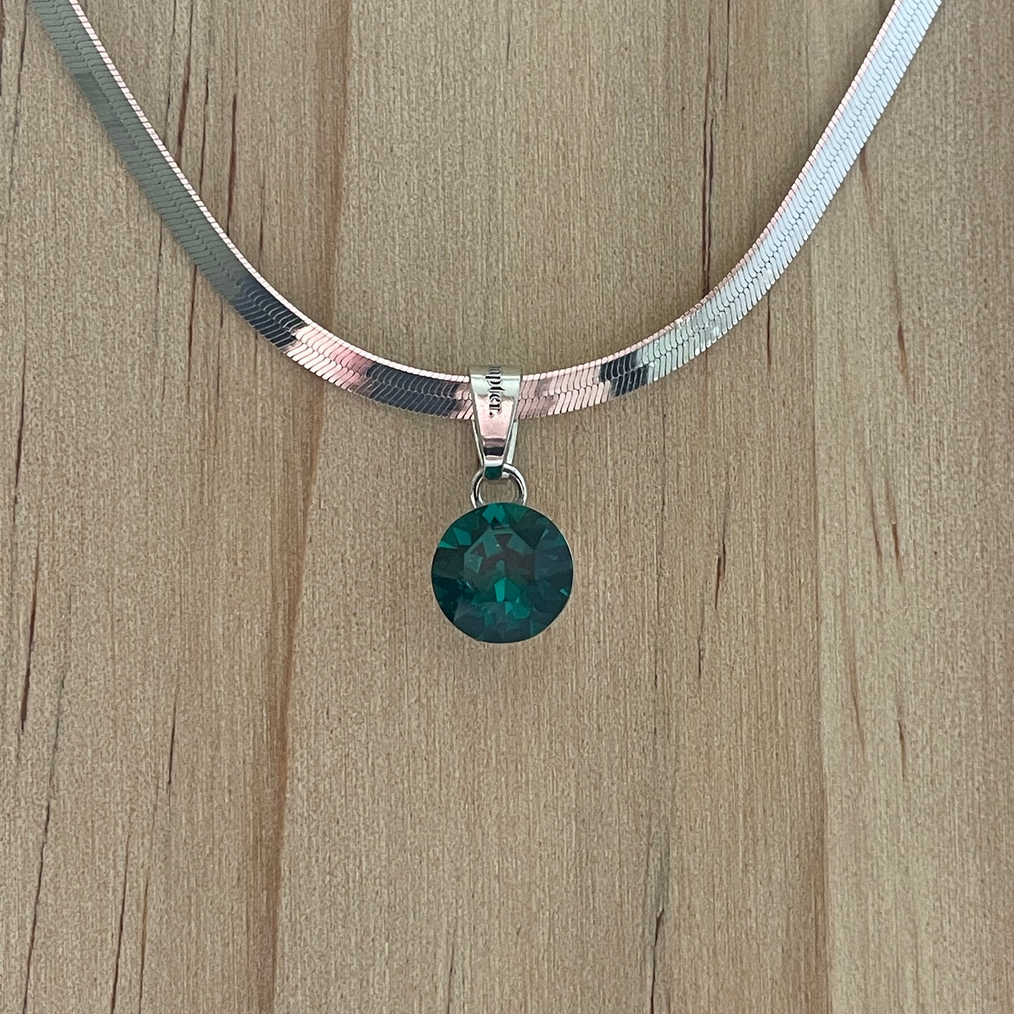 the SIMPLISTIC charm (Emerald)