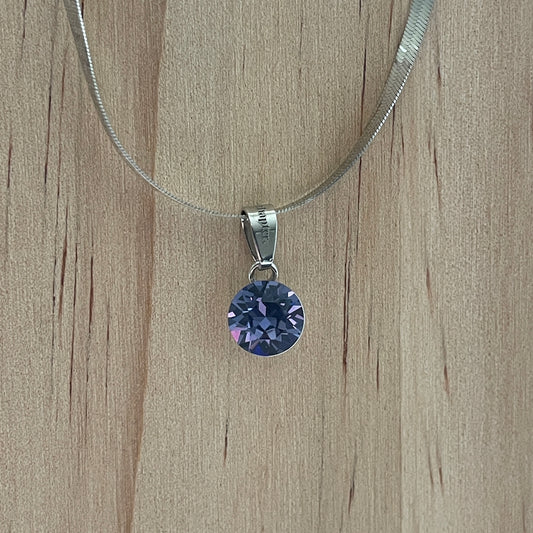 the SIMPLISTIC charm (Tanzanite)