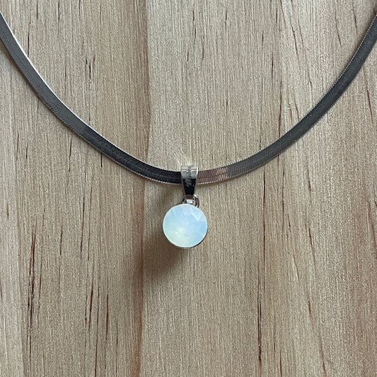 the SIMPLISTIC charm (White Opal)