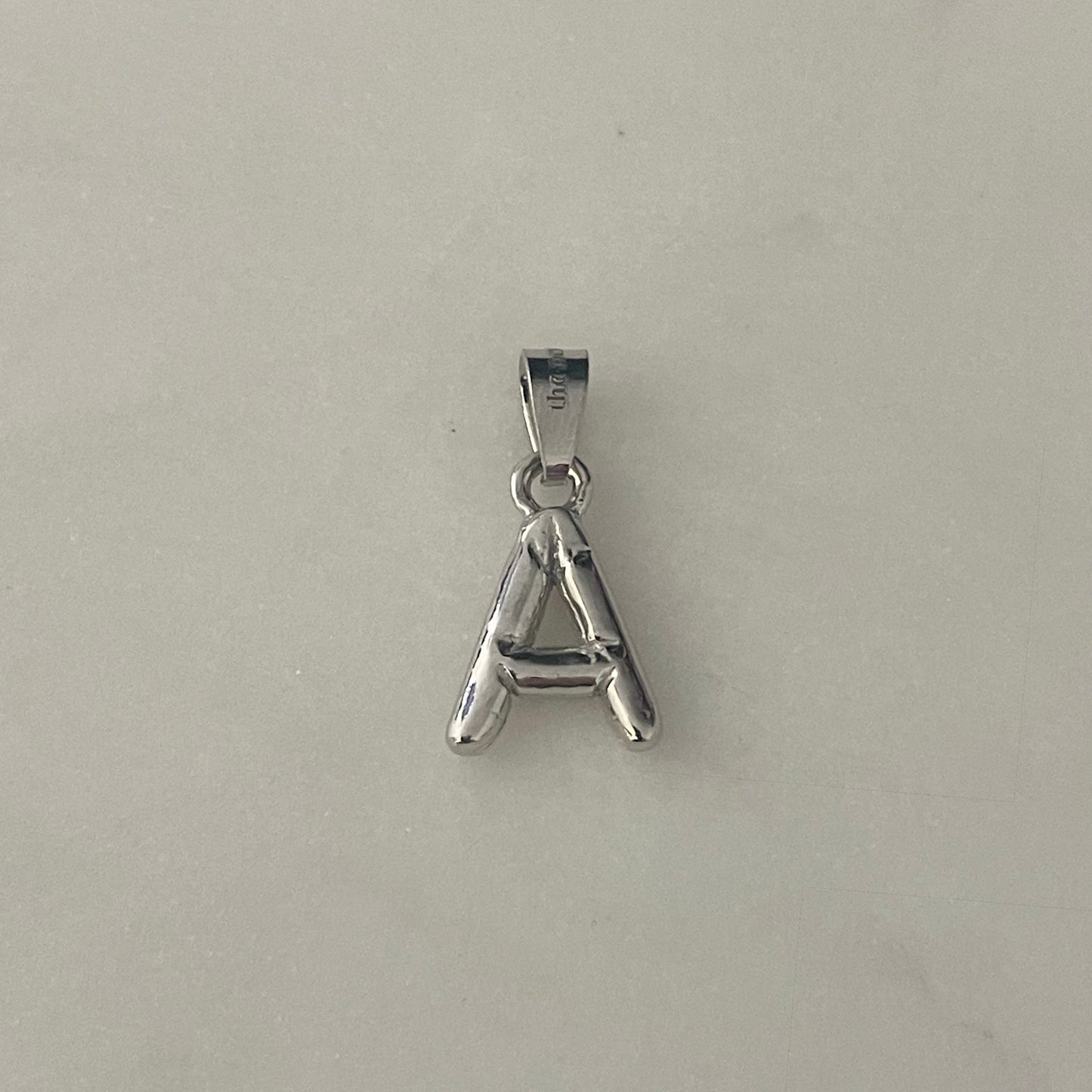 the BUBBLE LETTER charm