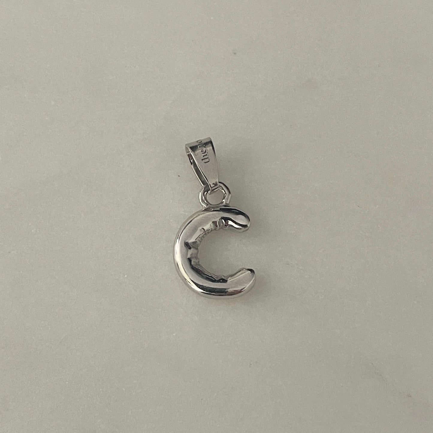 the BUBBLE LETTER charm