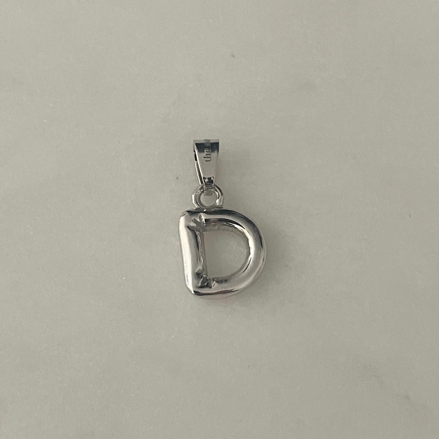 the BUBBLE LETTER charm