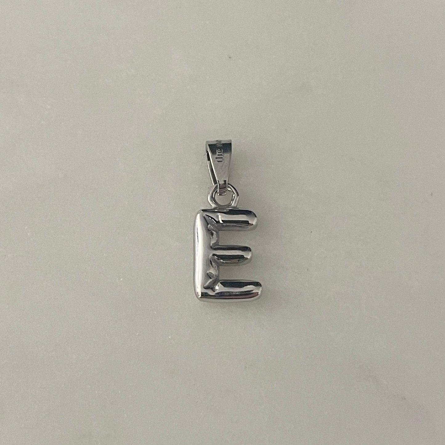 the BUBBLE LETTER charm