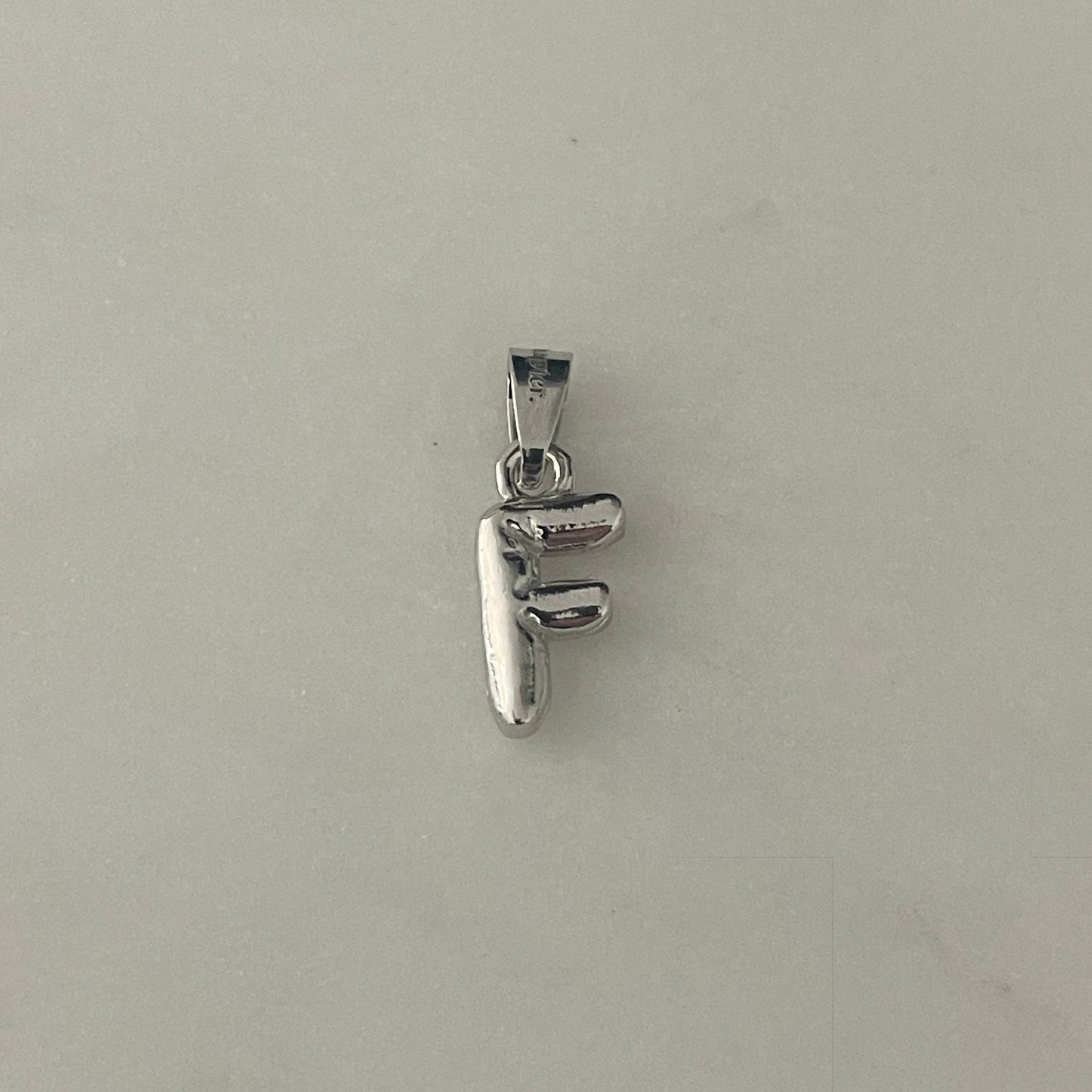 the BUBBLE LETTER charm