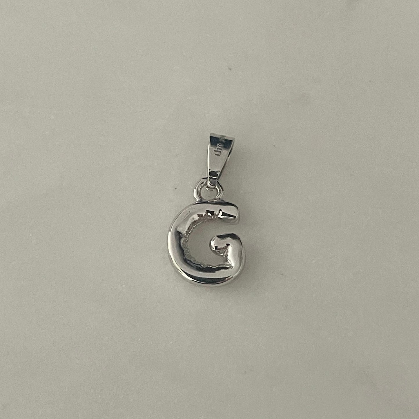 the BUBBLE LETTER charm
