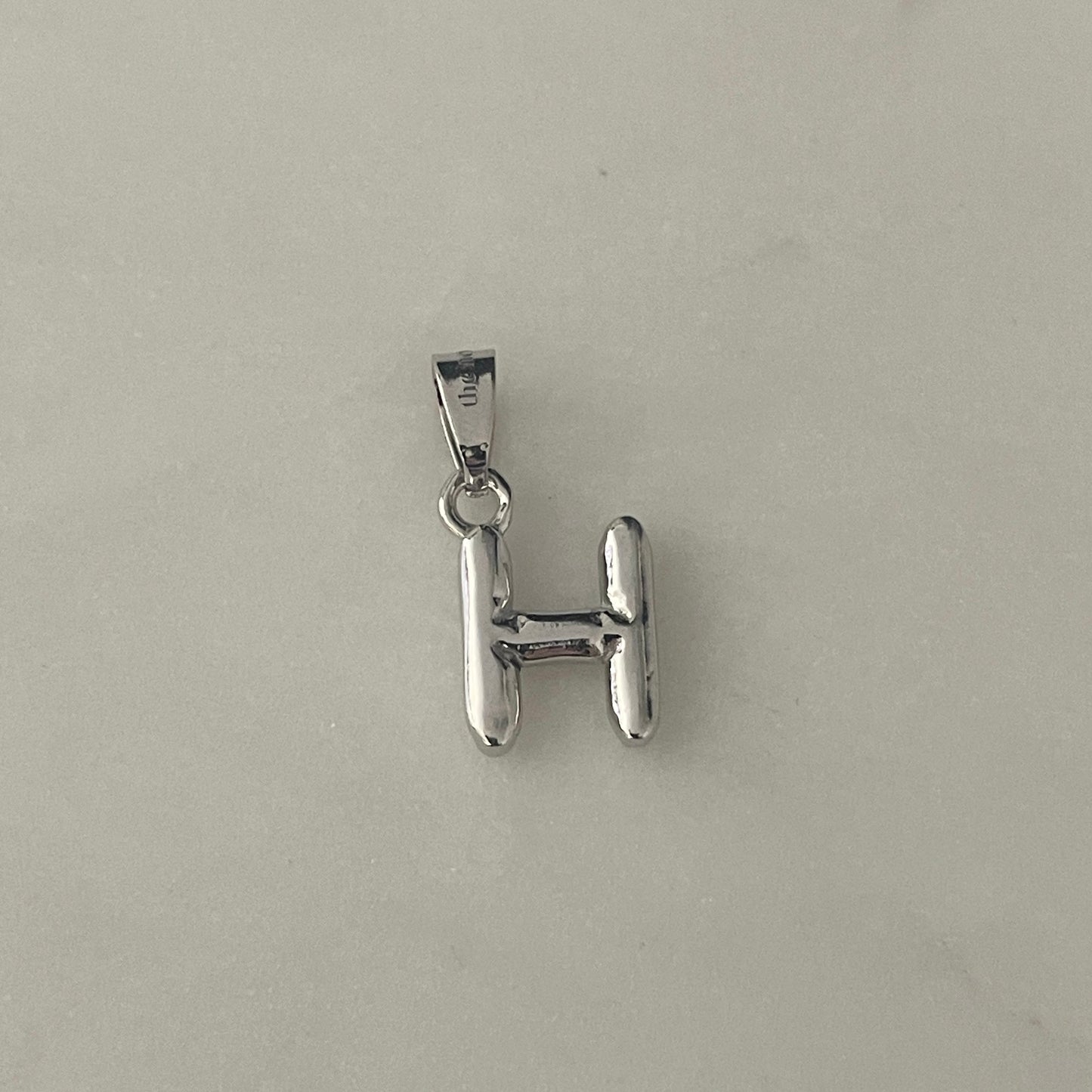 the BUBBLE LETTER charm