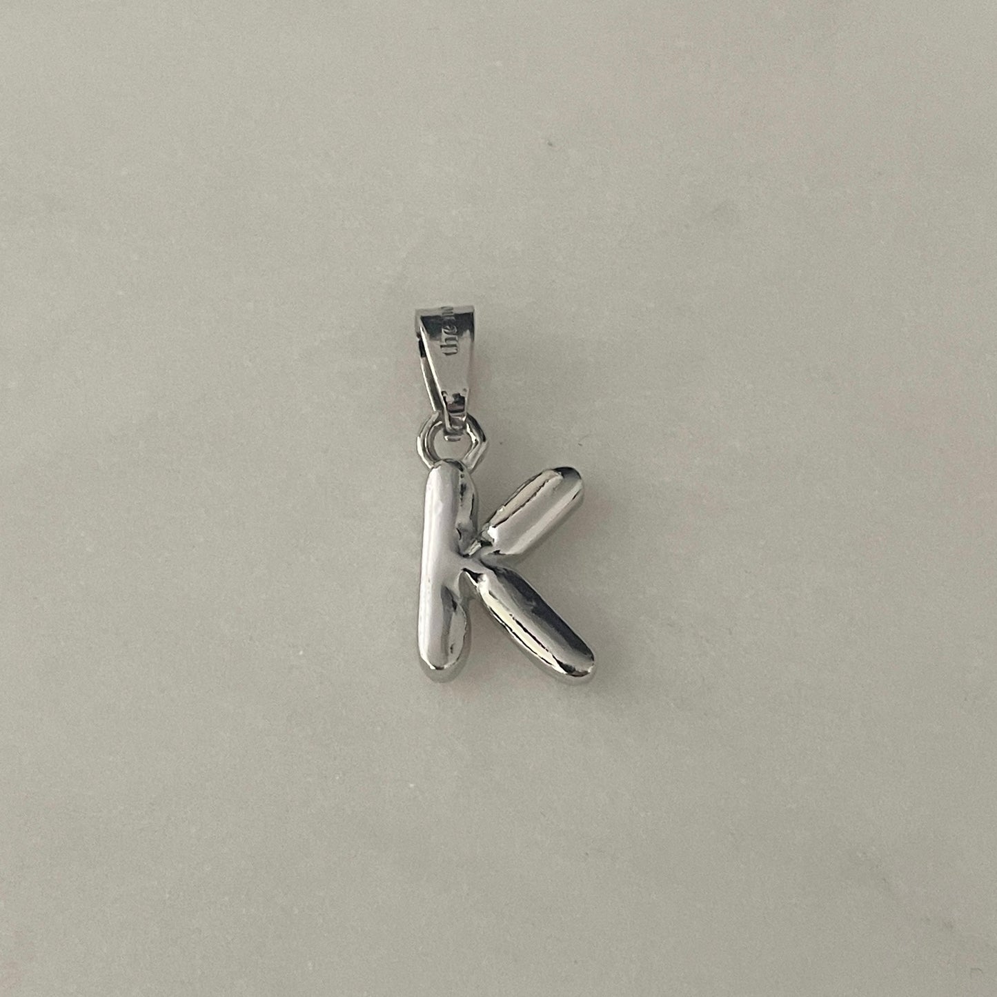the BUBBLE LETTER charm