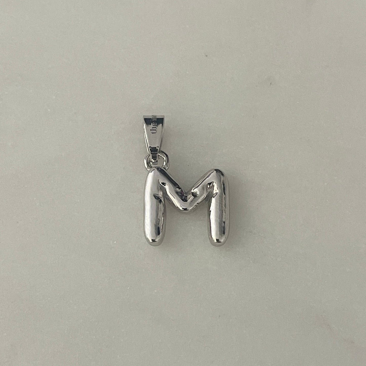 the BUBBLE LETTER charm