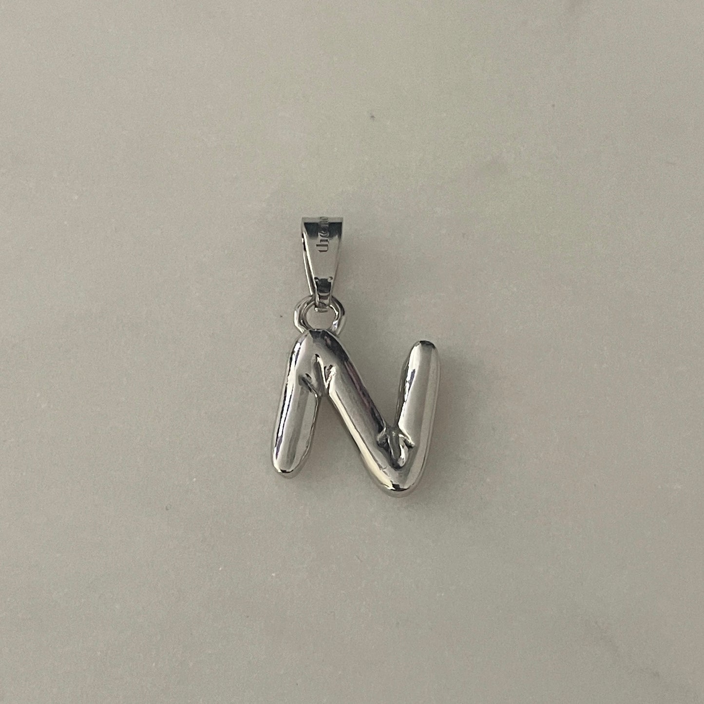 the BUBBLE LETTER charm