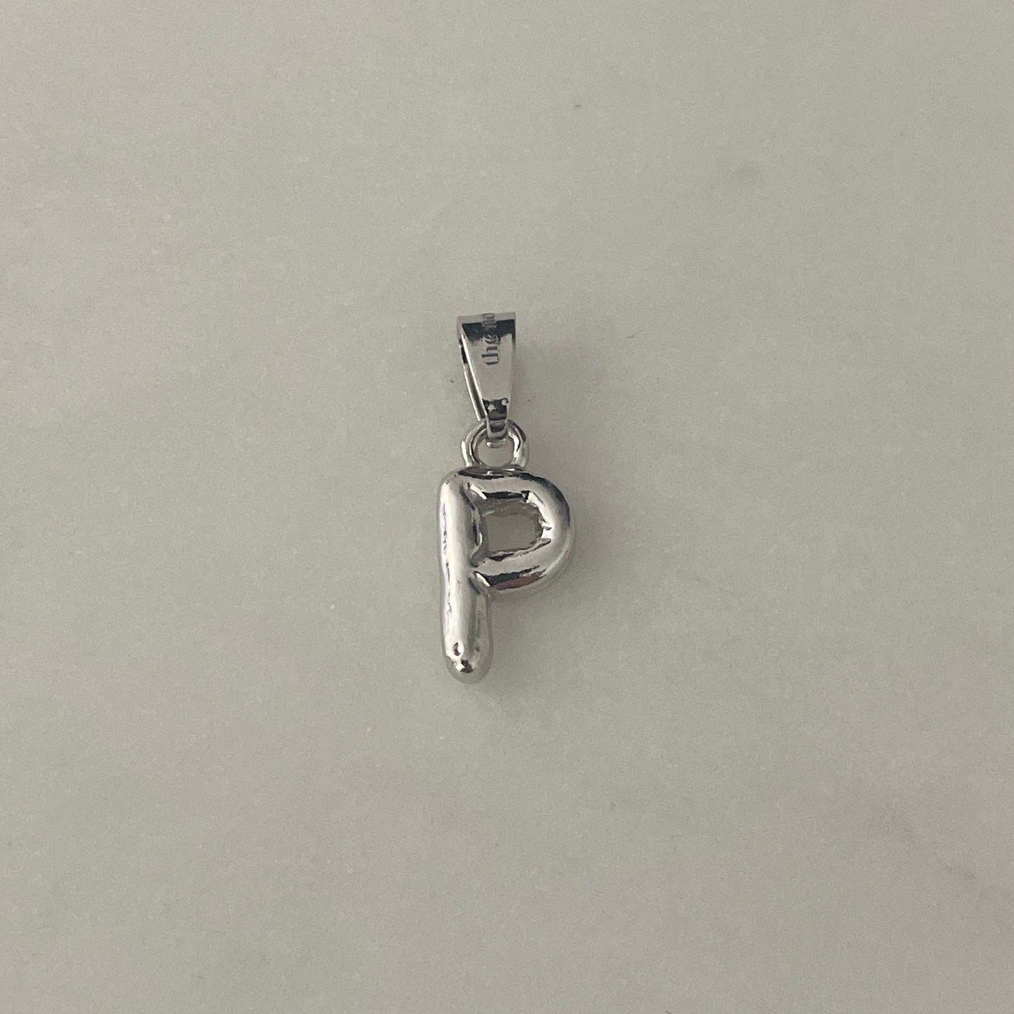 the BUBBLE LETTER charm