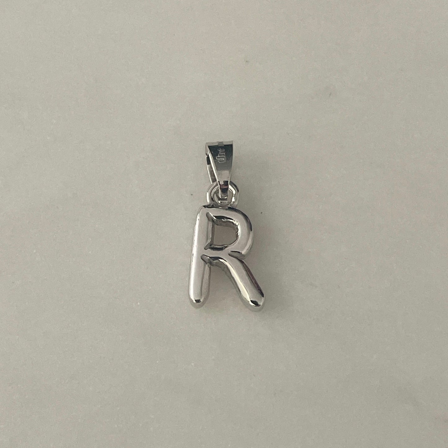 the BUBBLE LETTER charm