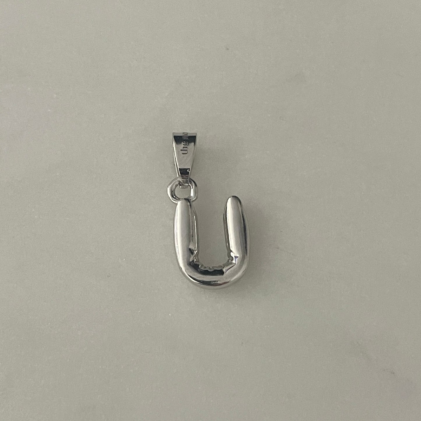 the BUBBLE LETTER charm