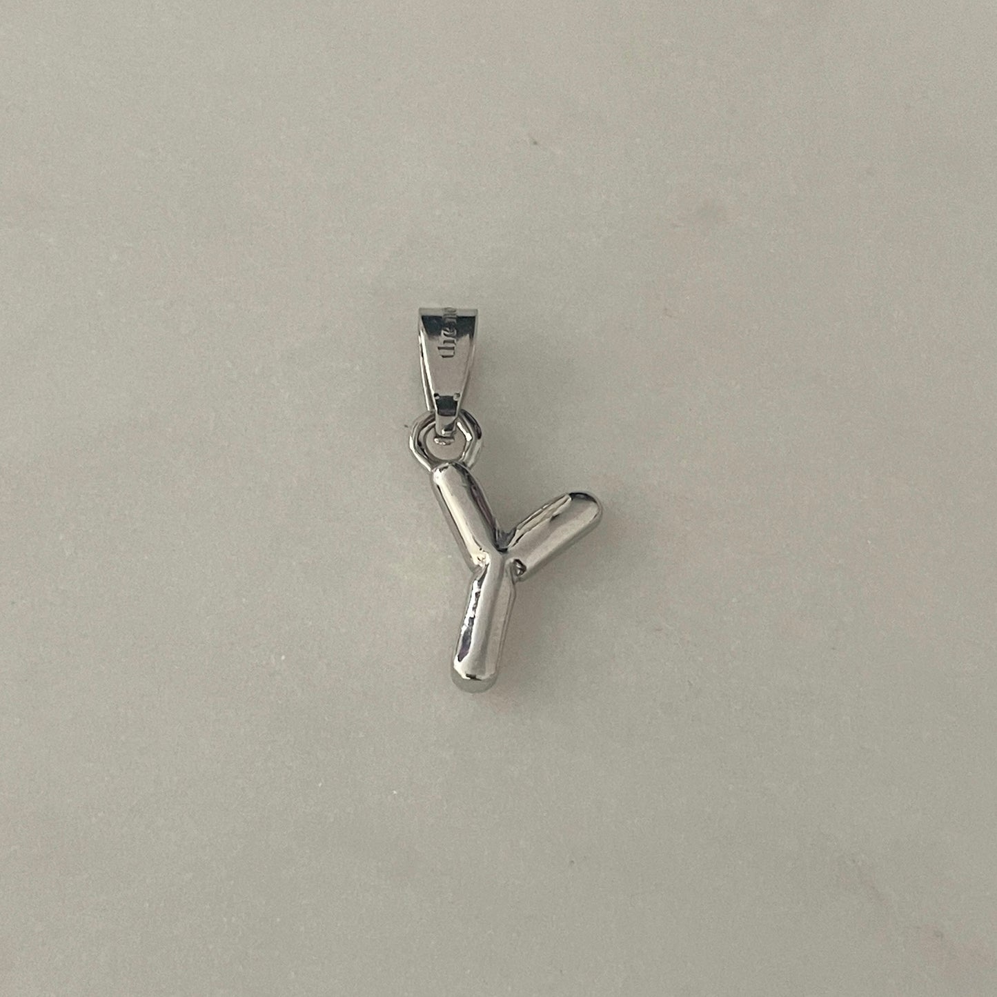 the BUBBLE LETTER charm