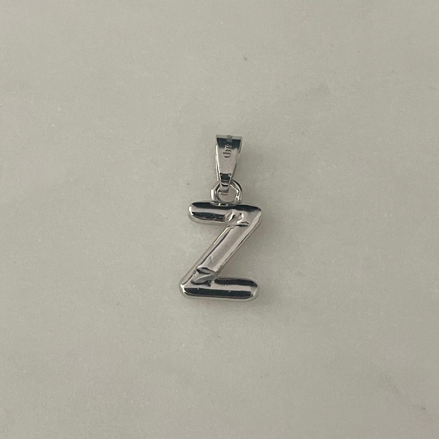the BUBBLE LETTER charm