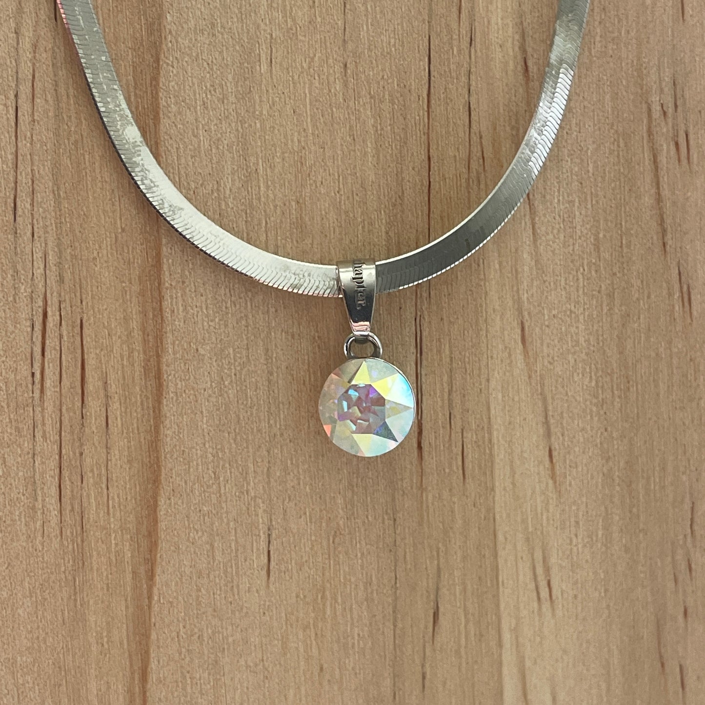 the SIMPLISTIC charm (Crystal AB)